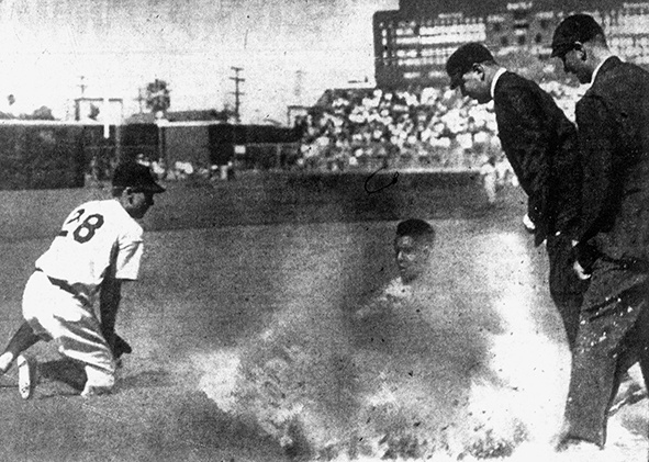 Gene Baker slides safely into third base, Los Angeles, 1953