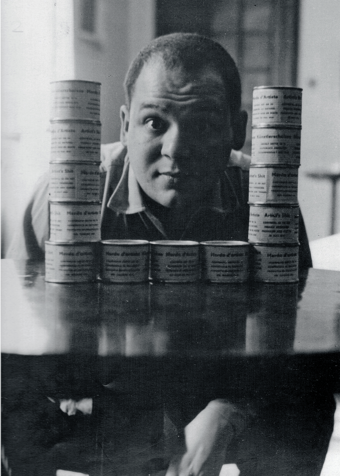Piero Manzoni with some cans of “Merda d’artista,” Milan, 1961