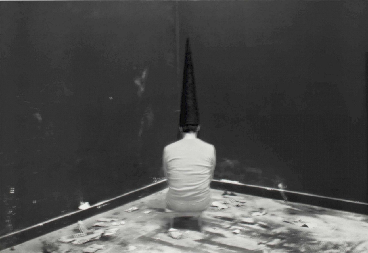 Santiago Sierra, “Hooded Woman Seated Facing the Wall,” 2003